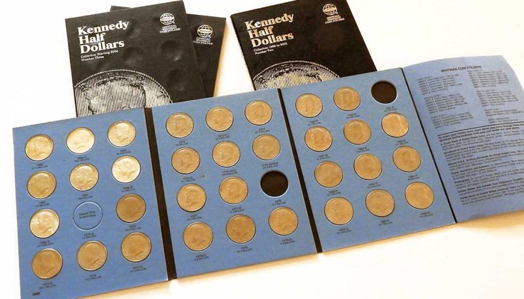 Kennedy half dollars in folder